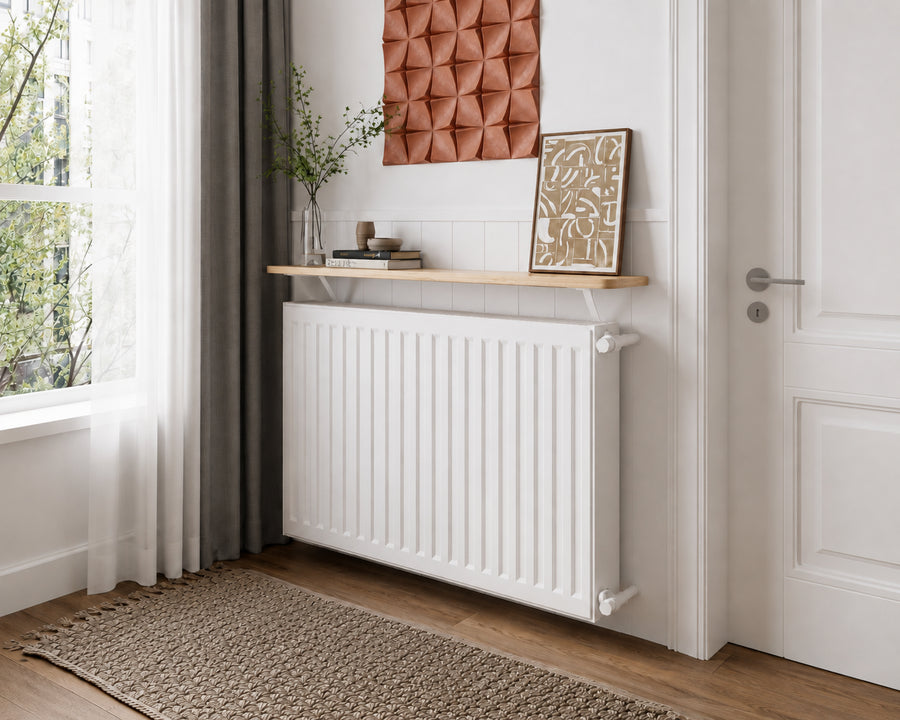 Loby radiator shelf in Natural above a radiator in a styled living space