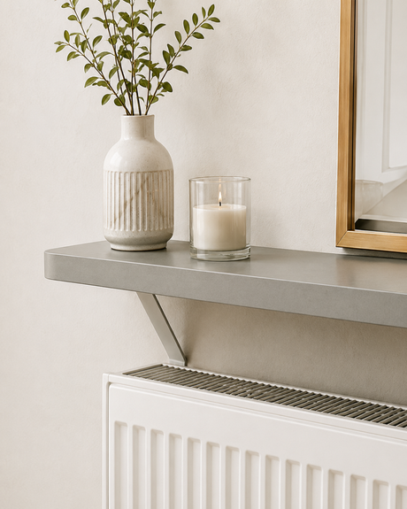 Grey Loby radiator shelf mounted above a radiator, with the support bracket running down behind it