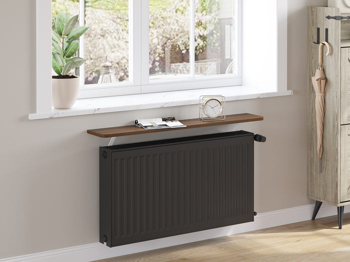 Dark Oak — Loby Essential radiator shelf in dark oak, fitted above a radiator in a home interior