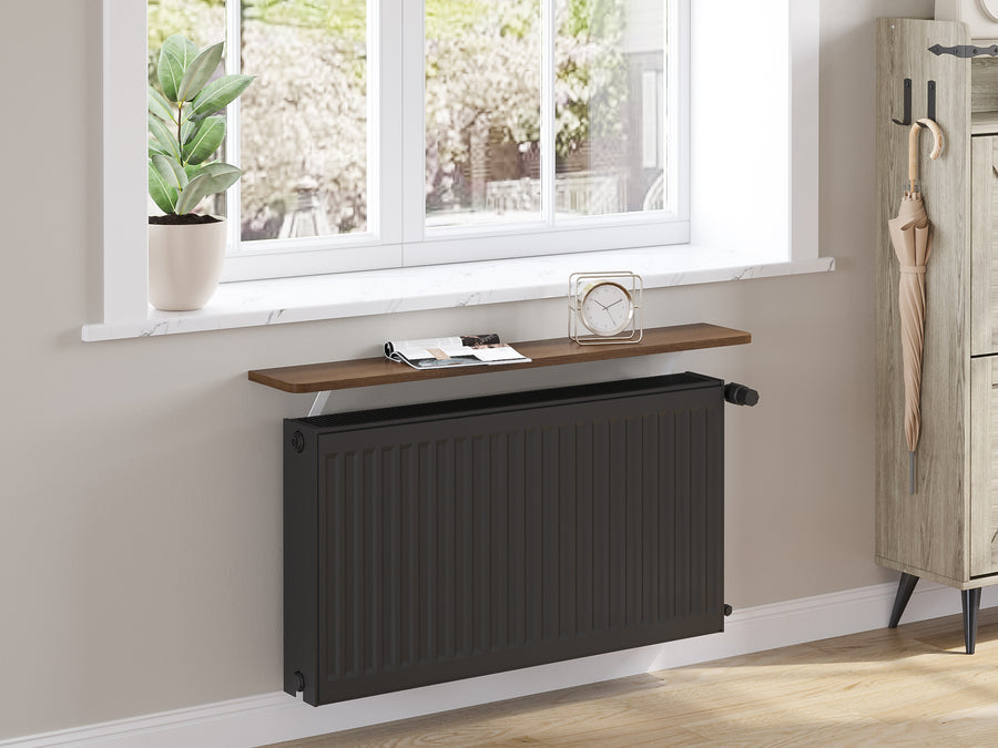 Dark Oak — Loby Essential radiator shelf in dark oak, fitted above a radiator in a home interior