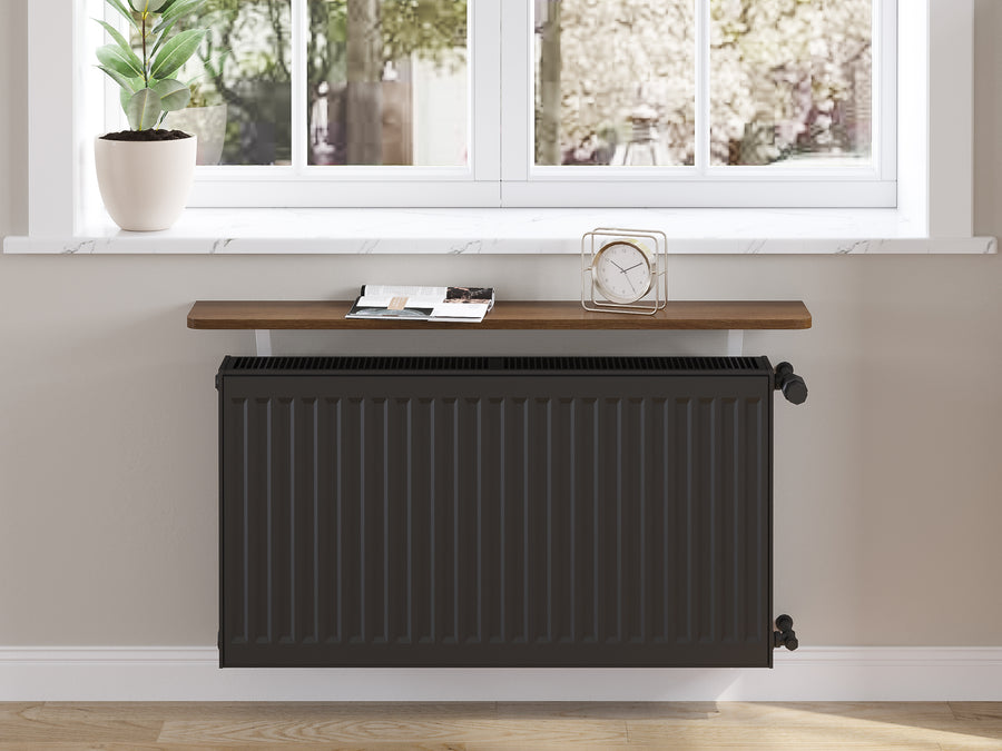 Dark Oak — Loby Essential radiator shelf in dark oak, fitted above a radiator in a home interior