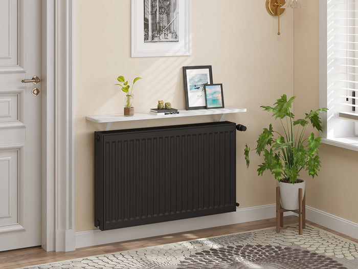 White — Loby Essential radiator shelf in white, fitted above a radiator in a home interior