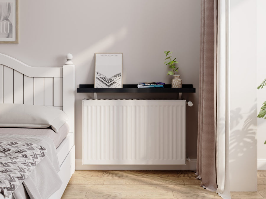 Black — Loby Edge radiator shelf in black, fitted above a radiator in a home interior