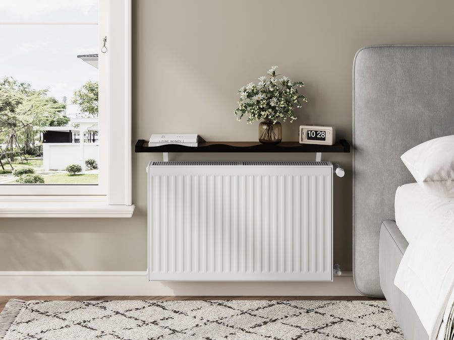 Black & Walnut — Loby Wavy radiator shelf fitted above a radiator in a bedroom