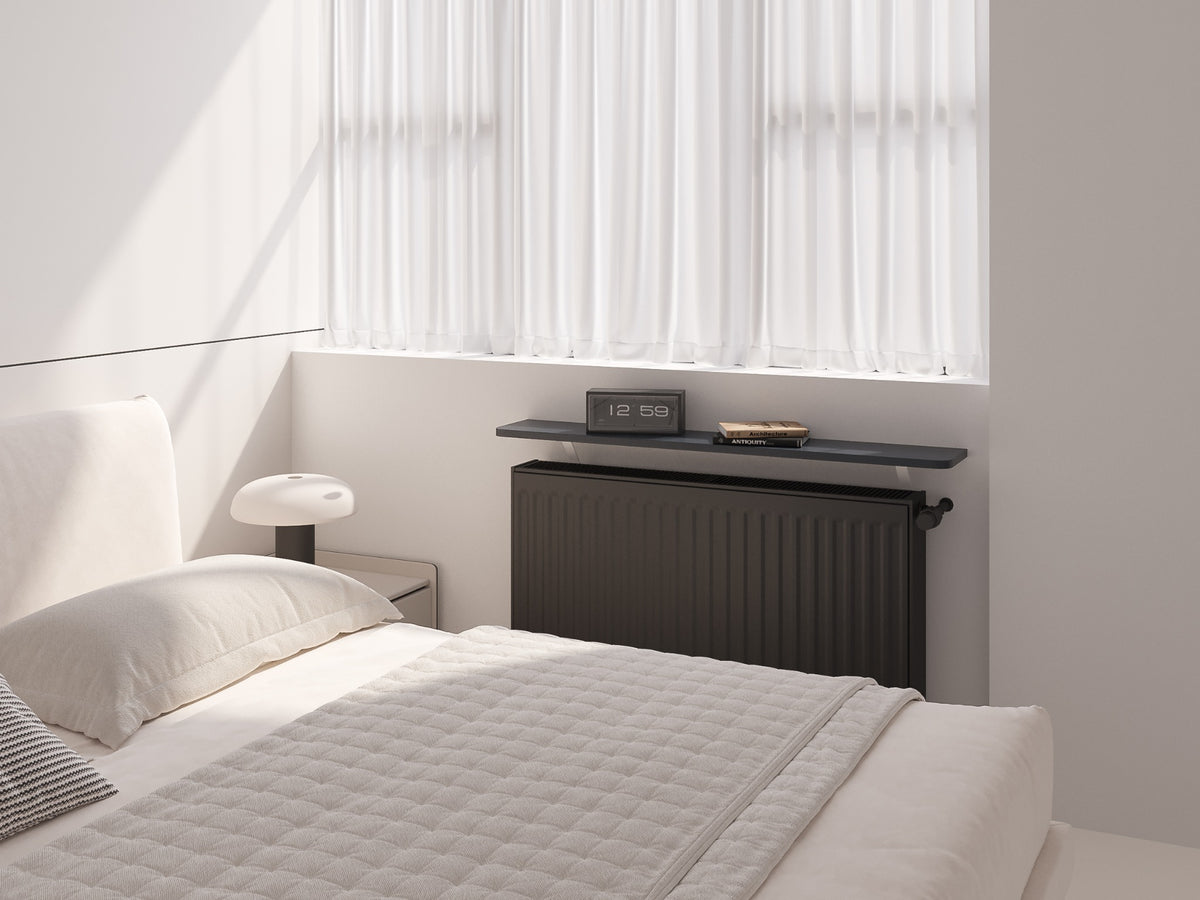 Essential radiator shelf fitted above a radiator in a styled UK interior