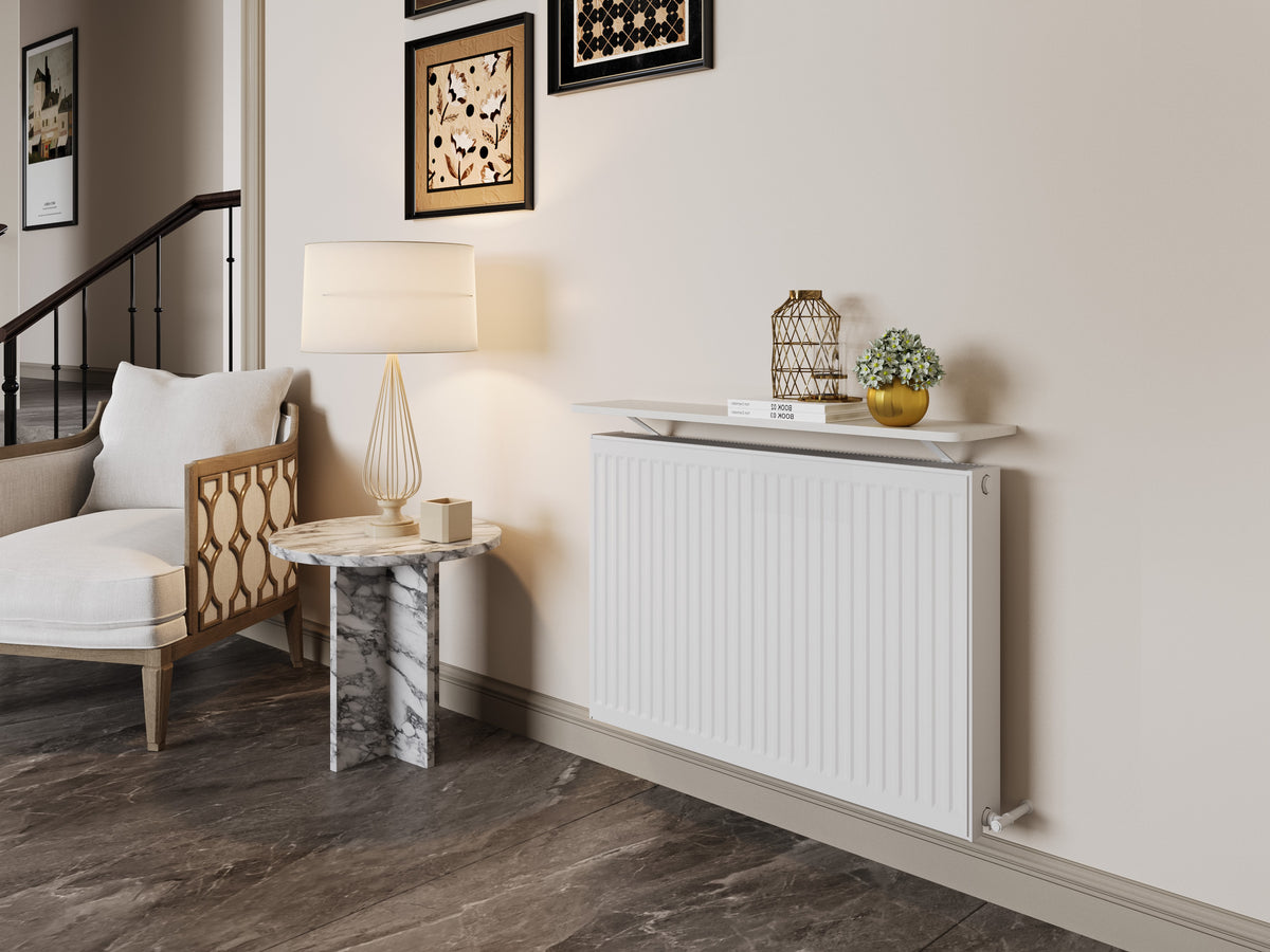 White Loby radiator shelf fitted above a white radiator in a warm neutral interior