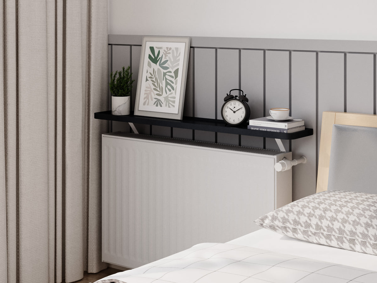 Black — Loby Curve radiator shelf in black, fitted above a radiator in a home interior