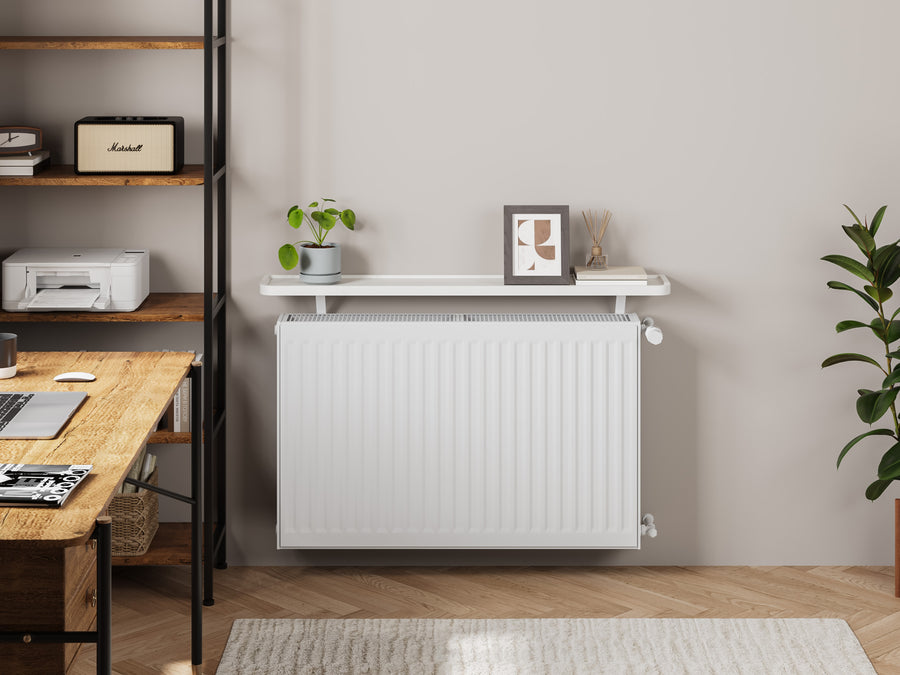 White — Loby Curve radiator shelf in white, fitted above a radiator in a home interior