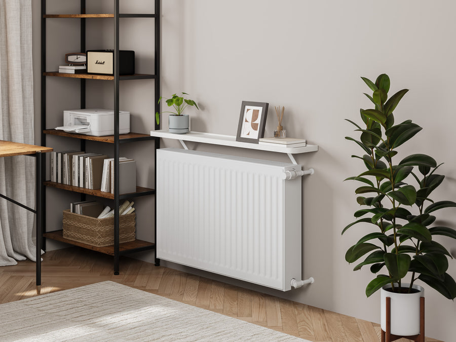 White — Loby Curve radiator shelf in white, fitted above a radiator in a home interior