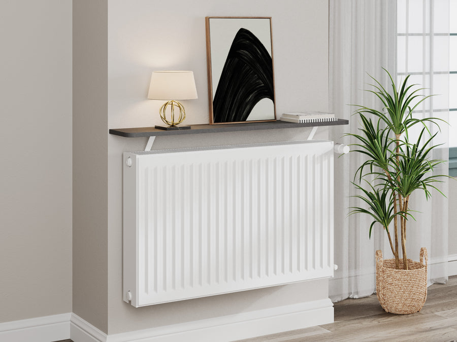 Grey — Loby Essential radiator shelf in grey, fitted above a radiator in a home interior